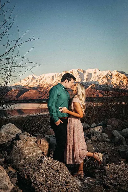 Beautiful couple kissing for bridal photoshoot at Utah lake