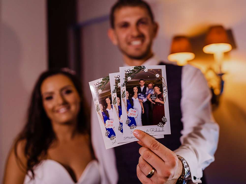 Couple with photo booth photos